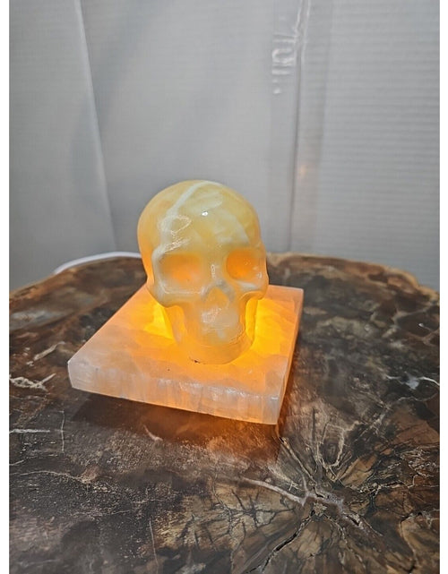 Load image into Gallery viewer, 2.17LB 2Pcs Natural Translucent Calcite Crystal Skull W/satin Spar Base &amp; Led
