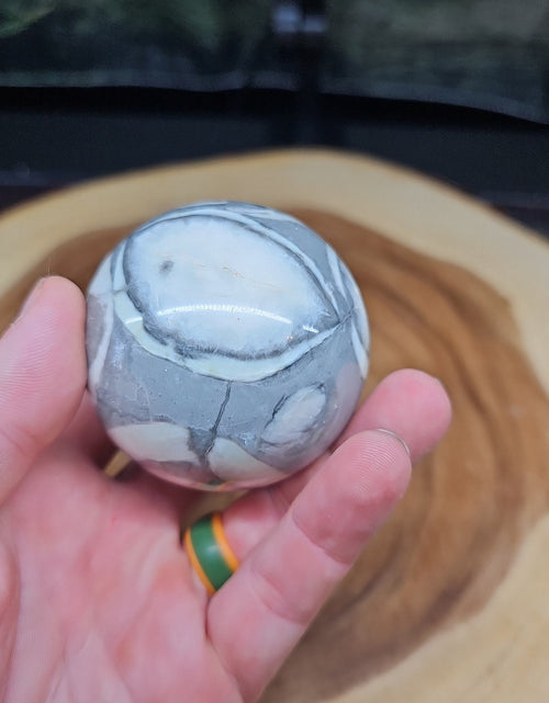Load image into Gallery viewer, 1000 Eye Ocean jasper quartz sphere
