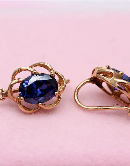 Load image into Gallery viewer, Purple Gold Earrings with Blue Stone
