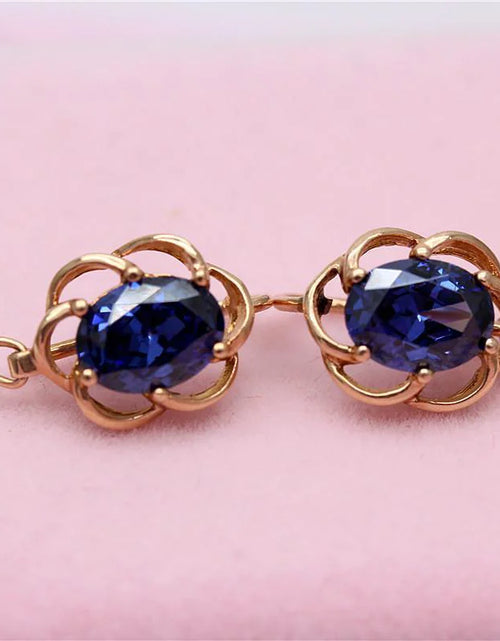 Load image into Gallery viewer, Purple Gold Earrings with Blue Stone
