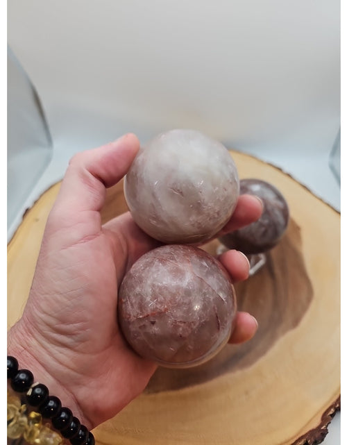 Load image into Gallery viewer, Fire Quartz Crystal Sphere 55-60mm W/stand 1 Each
