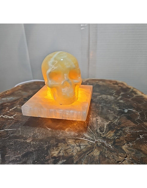 Load image into Gallery viewer, 2.17LB 2Pcs Natural Translucent Calcite Crystal Skull W/satin Spar Base &amp; Led
