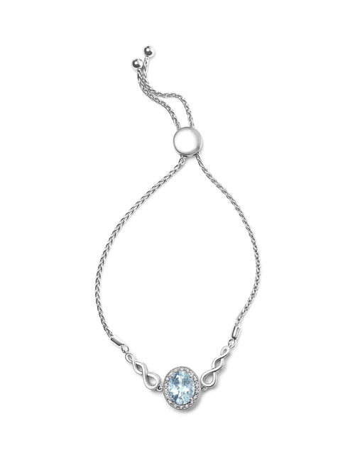 Load image into Gallery viewer, .925 Sterling Silver 10x8mm Oval Blue Topaz and Diamond Accent Lariat 4”-10” Adjustable Bolo Bracelet (H-I Color, SI1-SI2 Clarity)
